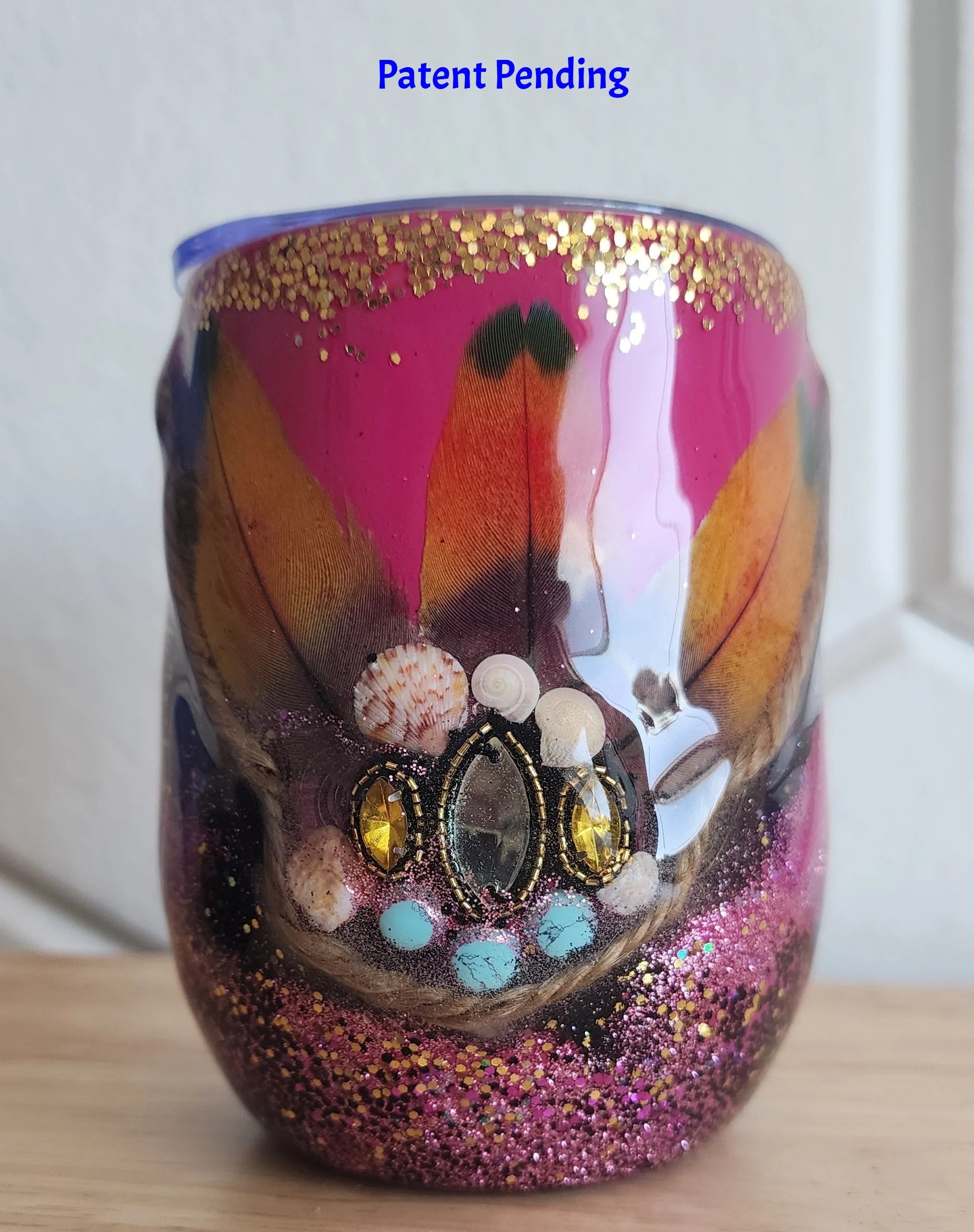 Magenta boho Saltwater Sips™ 12oz wine tumbler front view, exotic feathers rhinestone cluster howlite shells, Patent Pending